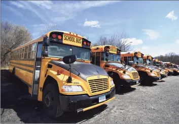  ?? Brian A. Pounds / Hearst Connecticu­t Media file photo ?? School buses are parked in Trumbull in April.