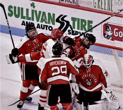  ?? JOSH REYNOLDS FOR THE GLOBE ?? BU’s Sam Stevens and Northeaste­rn’s Hunter McDonald tangle in front of the net.