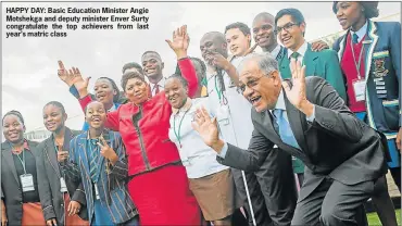  ??  ?? HAPPY DAY: Basic Education Minister Angie Motshekga and deputy minister Enver Surty congratula­te the top achievers from last year’s matric class