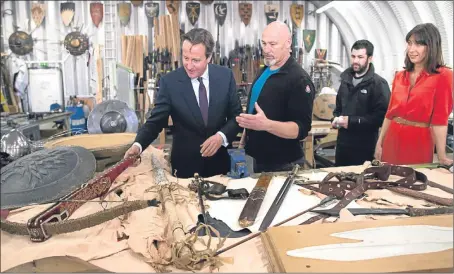  ?? Picture: PA. ?? David Cameron could not hide his delight as he toured the Game Of Thrones set during visit to Belfast. He and wife Samantha were shown the Great Sept of Baelor, site of some of the most dramatic scenes in the fantasy hit.