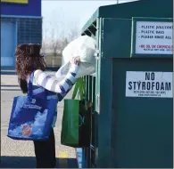  ?? NEWS PHOTO EMMA BENNETT ?? Renee Berreth drops off recycling at the Medicine Hat Mall recycling bins on Monday.