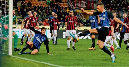  ?? AP ?? Inter Milan’s Ivan Perisic ( right) in action in their Italian Cup quarter- final against AC Milan at the San Siro Stadium in Milan on Wednesday. AC Milan won 1- 0. —