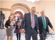  ?? SCOTT APPLEWHITE/ASSOCIATED PRESS ?? Senate Minority Leader Chuck Schumer, left and Sen. Dick Durbin, D-Ill., walk in the Capitol on Thursday. President Donald Trump rejected a deal on immigratio­n