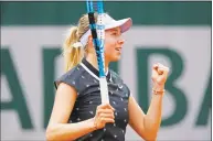  ?? Christophe Ena / Associated Press ?? Amanda Anisimova clenches her fist after scoring a point against Aryna Sabalenka during their second-round match Thursday at the French Open.