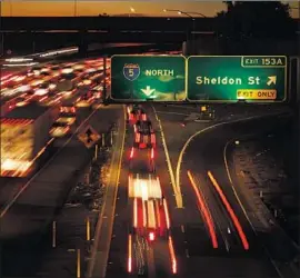  ?? Genaro Molina Los Angeles Times ?? TRAFFIC ON the 5 in Sun Valley. The Trump administra­tion is moving to block tougher Obama-era automobile mileage standards to combat climate change.