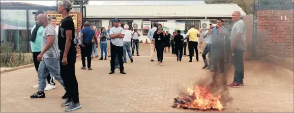  ??  ?? DESTROYED: Tender documents were removed from the Department of Education’s offices in Kimberley and set alight outside the premises. Picture: Supplied