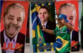  ?? ERALDO PERES/ASSOCIATED PRESS ?? A runoff election between Brazil’s President Jair Bolsonaro (center) and Luiz Inácio Lula da Silva (left) is set for Oct. 30.