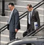  ?? SUSAN WALSH / ASSOCIATED PRESS ?? Deputy Chief of Staff for Policy Rick Dearborn (left) and Senior Policy Adviser Stephen Miller leave the Executive Office Building.