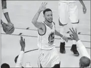 ?? [AP PHOTO] ?? Golden State Warriors guard Stephen Curry celebrates after scoring against the Cleveland Cavaliers during the first half of Game 2 on Sunday in Oakland, Calif.