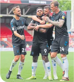  ??  ?? Assombalon­ga (centre) after scoring Boro’s second