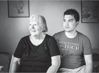  ?? CHRISTOPHE­R KATSAROV THE CANADIAN PRESS ?? Elizabeth Hill sits with her live-in student Julio Hernandez in her home in Toronto.