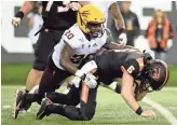  ??  ?? Oregon State quarterbac­k Jake Luton is sacked by Arizona State linebacker Khaylan Kearse-Thomas on Nov. 16.