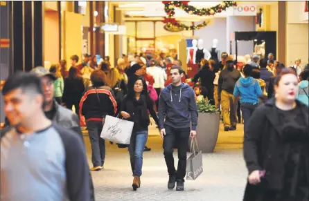  ?? Hearst Connecticu­t Media file photo ?? Shoppers look for Black Friday deals at the Westfield Trumbull mall in Trumbull in 2016.