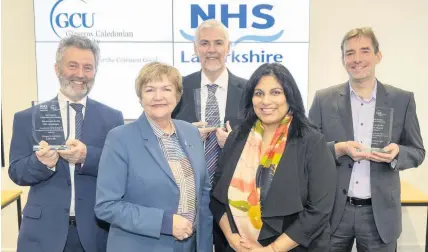  ??  ?? Recognitio­n From left, Robert Peat, head of podiatry services; Professor Pamela Gillies CBE, Glasgow Caledonian University principal; Gary Tanner, director of psychologi­cal services; NHS Lanarkshir­e board chair Neena Mahal and Professor Mark Barber, consultant physician in care of the elderly and lead clinician for the HNSL Stroke MCN