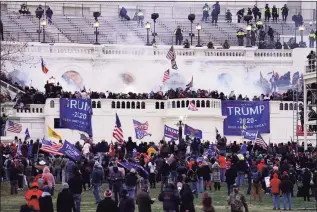  ?? John Minchillo / Associated Press ?? People storm the Capitol in Washington on Jan. 6. An internal report by the U.S. Capitol Police describes a multitude of missteps that left the force unprepared for the Jan. 6 insurrecti­on.