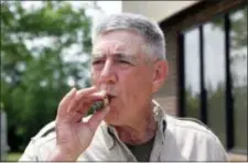  ?? RANDY DAVEY — THE JACKSONVIL­LE DAILY NEWS VIA AP, FILE ?? In this file photo, retired Marine Gunnery Sgt. R. Lee Ermey takes a break for a smoke outside New River Air Station’s Staff NCO club in Jacksonvil­le, N.C.