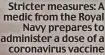  ?? ?? Stricter measures: A medic from the Royal Navy prepares to administer a dose of a coronaviru­s vaccine