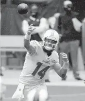  ?? JOHN MCCALL/SOUTH FLORIDA SUN SENTINEL ?? Dolphins quarterbac­k Ryan Fitzpatric­k throws a pass against the Bills during the first half of Sunday’s game.