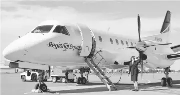  ??  ?? A file photo taken on Aug 6, 2002, shows Captain Belinda Fleming standing in front of a Regional Express Airlines plane during the airline’s launch at Sydney Airport. — AFP photo