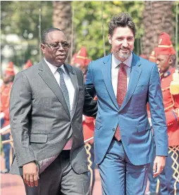  ?? CHEIKH A.T. THE ASSOCIATED PRESS FILE PHOTO ?? Senegalese President Macky Sall joins Prime Minister Justin Trudeau upon Trudeau’s arrival at the Presidenti­al Palace in Dakar, Senegal, on Feb. 12.