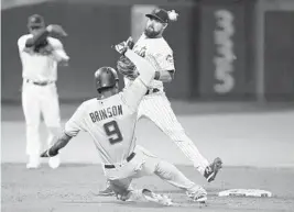  ?? MARY ALTAFFER/AP ?? Lewis Brinson of the Marlins is forced out at second by the Mets’ Luis Guillorme on a game-ending double play during the ninth inning Tuesday night in New York.