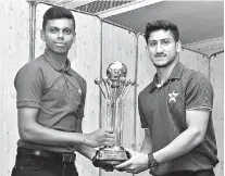  ??  ?? Sri Lanka U-19 Captain Nipun Dhananjaya (left) and Pakistan U-19 Captain Rohail Nazir with the trophy