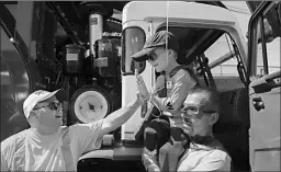  ?? Associated Press ?? Six-year-old Ethan Dean who was diagnosed with cystic fibrosis at two weeks old gets a high five while carried by Capt. Mitch Zak during his stop at The Sacramento Bee to pick up recycling on Tuesday in Sacramento, Calif.