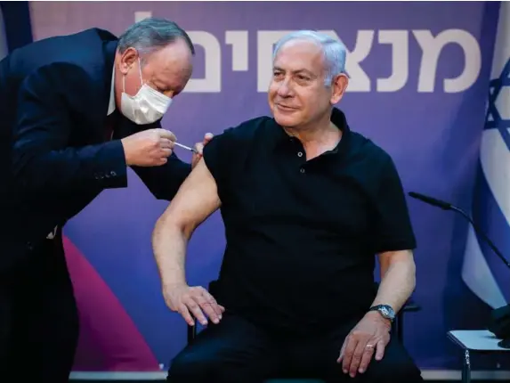  ??  ?? Israeli PM Benjamin Netanyahu receives a second jab (Getty)