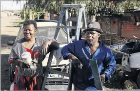  ?? PHOTO: SUPPLIED ?? IT ’ S IN THE FAMILY: Mavis Ramaoto and her husband Solomon outside their Phelindaba home near Bloemfonte­in. The two work together in their family business. The husband is a panel beater while the wife is a primer