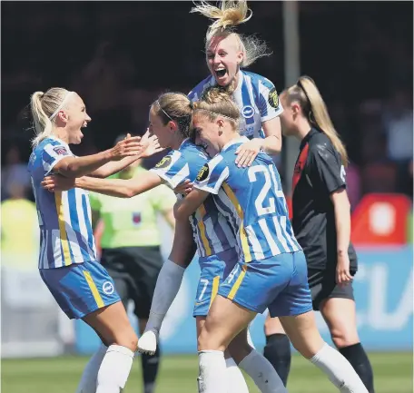  ?? ?? Brighton celebrate Aileen Whelan’s goal against Everton