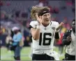  ?? ERIC GAY — THE ASSOCIATED PRESS ?? Jacksonvil­le Jaguars quarterbac­k Trevor Lawrence (16) celebrates as he jogs off the field after the teams NFL football game against the Houston Texans in Houston, Sunday, Nov. 26, 2023.