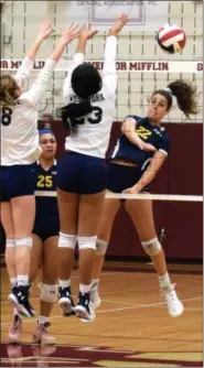  ?? AUSTIN HERTZOG — DIGITAL FIRST MEDIA ?? Pope John Paul II’s Hanna Tulli (22) sends a kill past a pair of West York blockers during a PIAA 3A quarterfin­al Saturday at Gov. Mifflin.