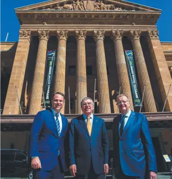  ?? Picture: AFP ?? IOC president Thomas Bach is flanked by Brisbane Lord Mayor Adrian Schrinner (left) and Australian Olympic Committee president John Coates (R) and discussed a Brisbane Olympic bid.