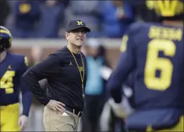  ?? Carlos Osorio ?? The Associated Press Jim Harbaugh enters his fourth season as Michigan coach boasting experience and tenacity on defense and an upgrade at quarterbac­k in transfer Shea Patterson.