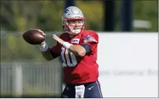  ?? STEVEN SENNE — THE ASSOCIATED PRESS ?? Patriots quarterbac­k Mac Jones warms up during practice on Wednesday in Foxborough, Mass. Jones has a completion percentage of 71.1in his first five games.