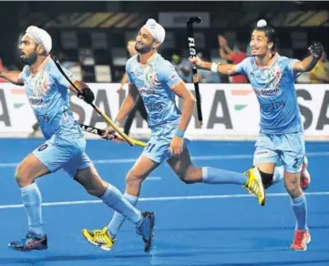  ?? AFP ?? Simranjeet Singh (left) celebrates scoring the second goal against Belgium during their World Cup Pool C match on Sunday.