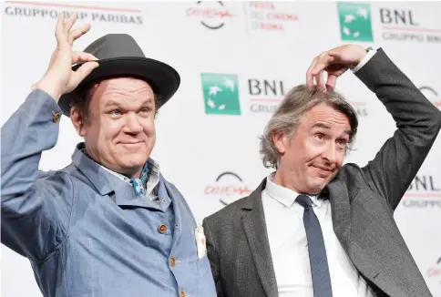  ??  ?? US actor John C. Reilly (left) and British actor and screenwrit­er Steeve Coogan pose during a photocall for the film ‘Stan and Ollie’ at the Auditorium Parco della Musica in Rome on Oct 24 during the Rome Film Festival. — AFP photo