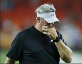  ?? RON SCHWANE — THE ASSOCIATED PRESS ?? Philadelph­ia Eagles coach Doug Pederson walks off the field after the Cleveland Browns defeated the Eagles 5-0 in an NFL preseason football game Thursday.