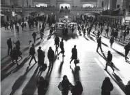  ?? AFP / Getty Images file photo ?? New York commuters head out the first week of daylight saving time in 2019. Is year-round daylight saving time the answer to our clock-changing woes? History says no.