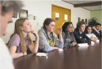  ?? Jessica Christian / The Chronicle ?? At Bishop O’Dowd High School in Oakland, Principal James Childs (left) listens as students Alden O’Rafferty, Olivia Talley, Sofia Odeste, Eli McAmis, Paulina Harding and Aleki Lozano discuss their feelings Thursday after the school shooting in...