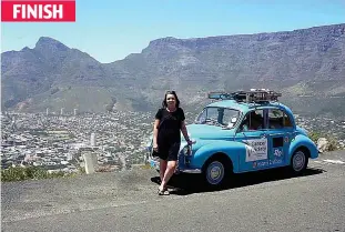  ??  ?? Great es-Cape: Miss Morrison in front of Table Mountain in Cape Town