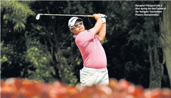  ??  ?? Panuphol Pittayarat hits a shot during the third round of the Yeangder Tournament Players Championsh­ip.