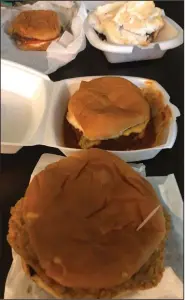  ??  ?? A Steak Sandwich (foreground), Chili Cheeseburg­er, Cheeseburg­er and a slice of Chocolate Pie were ordered from Wink’s Dairy Bar.