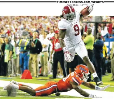  ?? ASSOCIATED PRESS FILE PHOTO ?? SATURDAY, JULY 15, 2017 Alabama running back Bo Scarbrough runs over Florida defensive back Chauncey Gardner during last year’s Southeaste­rn Championsh­ip game in early December. Alabama is favored to win its fourth straight SEC title this year.