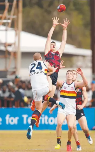  ?? Picture: GETTY IMAGES ?? Demon Jake Lever marks the ball over Sam Jacobs in yesterday’s big win.