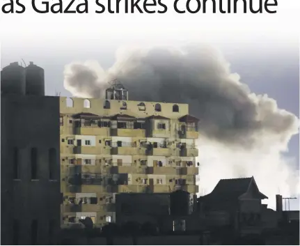  ?? AFP PHOTO ?? GAZA BOMBINGS
Smoke rises over buildings amid Israeli bombardmen­t in Rafah in the southern Gaza Strip on Saturday, Feb. 3, 2024, as fighting continues between Israel and the Palestinia­n Hamas group.
