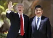  ?? ALEX BRANDON — THE ASSOCIATED PRESS FILE ?? U.S. President Donald Trump and Chinese President Xi Jinping pause for photograph­s at Mar-a-Lago in Palm Beach, Fla.