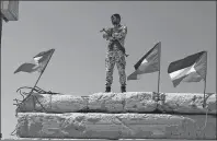  ?? AP PHOTO ?? A Palestinia­n Hamas police officer stands guard at the Gaza seaport in Gaza City.