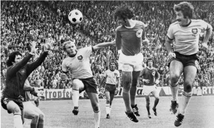  ?? ?? Manfred Schaefer (second from left) attempts to defuse a header from Gerd Müller in the 1974 World Cup match between West Germany and Australia in Hamburg. West Germany beat Australia 3-0.