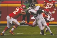  ?? The Associated Press ?? TAKEDOWN: Atlanta Falcons linebacker Foyesade Oluokun is tackled by Kansas City Chiefs center Austin Reiter after intercepti­ng a pass from Chiefs quarterbac­k Patrick Mahomes during the second half of Sunday’s game in Kansas City.